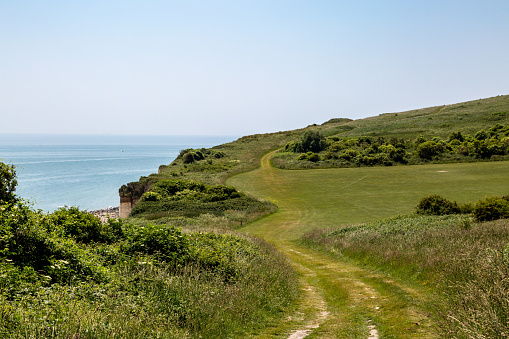 The coastal path from Eastbourne towards Beachy Head, on a sunny summer's day