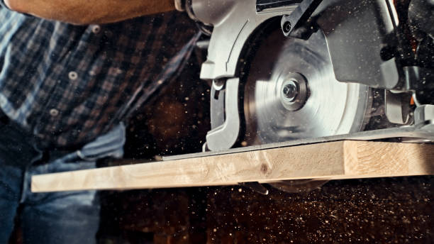 istock Male carpenter cutting wooden plank 1500290800