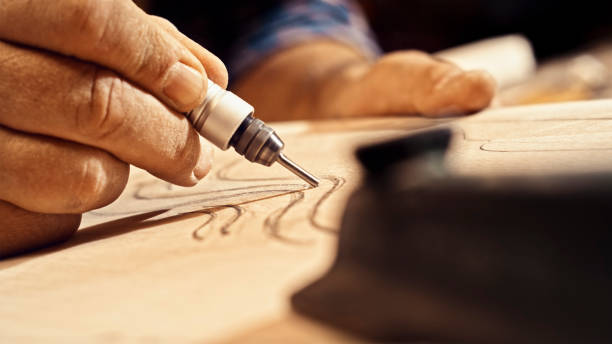 istock Male carpenter's hands carving on plank 1500290811