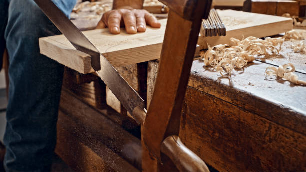 istock Handsaw cutting wooden plank 1500290822