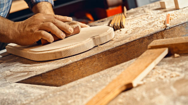 istock Carpenter's hands polishing wood 1500290823