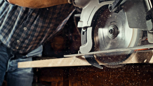 istock Male carpenter cutting wooden plank 1500290825