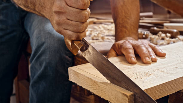 istock Handsaw cutting wooden plank 1500290826