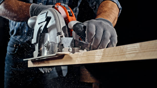 istock Male carpenter cutting wooden plank 1500290828