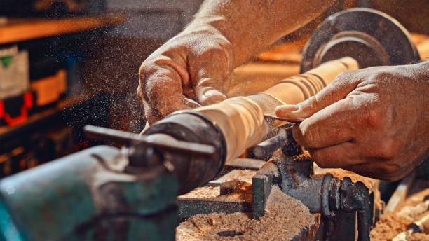 istock Carpenter's hands polishing wood 1500290843