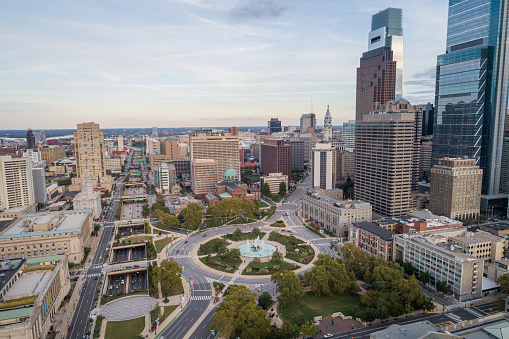 Logan Square and Philadelphia Skyline, Downtown. Pennsylvania, USA. Traffic circle center features a large fountain with whimsical statuary, garden areas with benches.