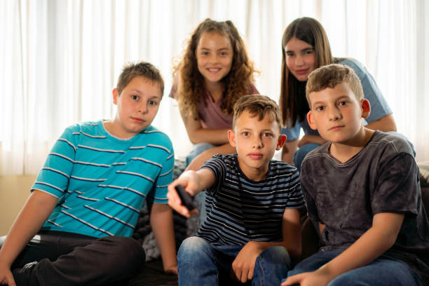 istock Group of children watching TV at home 1500291399