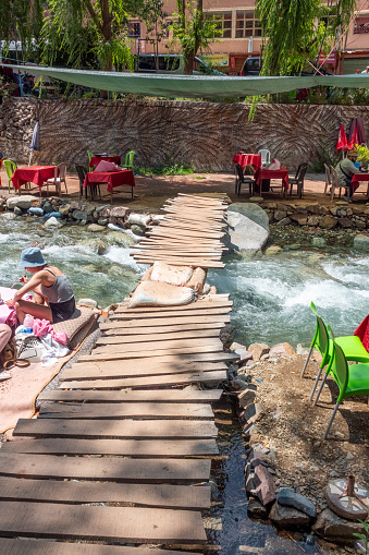 People in the background of a Footbridge over Ourika River in Setti Fatma at Atlas Mountains, Morocco