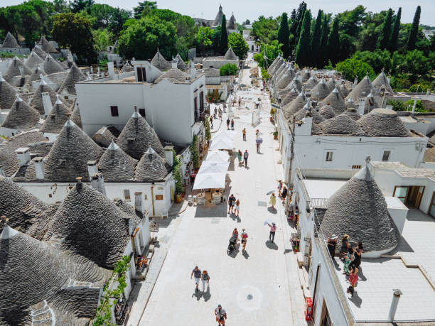 Traveling to Italy, Alberobello - historic town with trulli houses, high definition aerial photos of historic village in Puglia stock photo