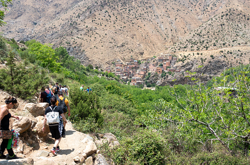 A group of tourists hiking at Ourika Valley in Atlas Mountains, Morocco
