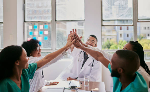 istock Celebrating with a group of doctors and nurses after a successful surgery with copy space, stock photo 1500306804