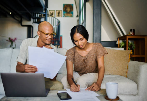 istock A young couple is going over some reports and making notes with copy space. Stock photo 1500307935