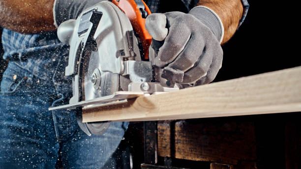 istock Male carpenter cutting wooden plank 1500308086