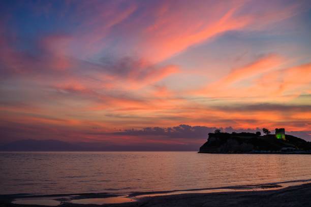 istock Beautiful sunset over an idyllic sandy beach and dramatic cliff face 1500308915