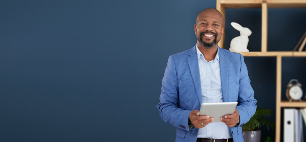 Black man, business and tablet for corporate management, planning or strategy on mockup at the office. Portrait of confident African American male CEO holding touchscreen for marketing on copy space