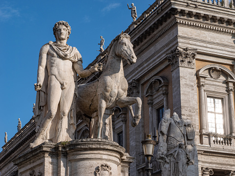 Fountain of Pigna on Cavour Square in Rimini, Italy. Town Hall in the background.