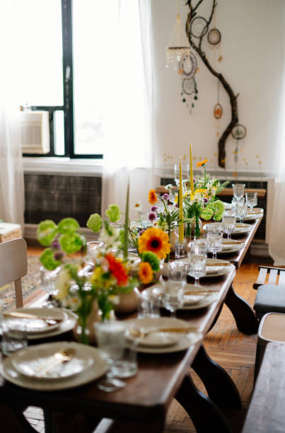 istock serving the table with fresh flowers and candles 1500309788