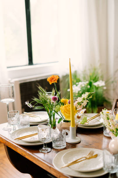 istock serving the table with fresh flowers and candles 1500309882