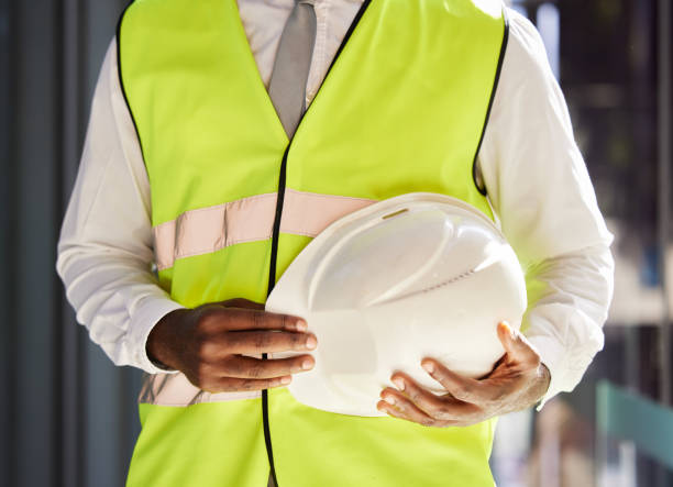istock Property development, architect and hands with a safety helmet for construction and engineering. Building, black man and business developer ready for real estate and infrastructure renovation 1500313922