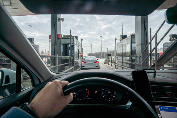 Approaching to a toll collection point at a multi-lane highway at sunny day.