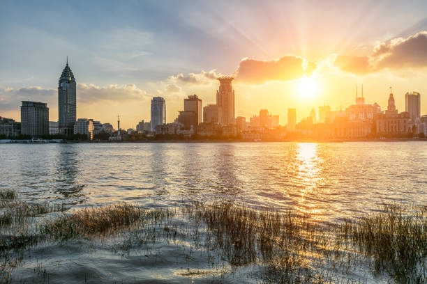 istock Building skyline and river water surface with sky cloudscape in Shanghai, China 1500320437