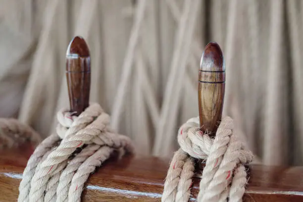 Nautical details on boat deck with rope and marine tool