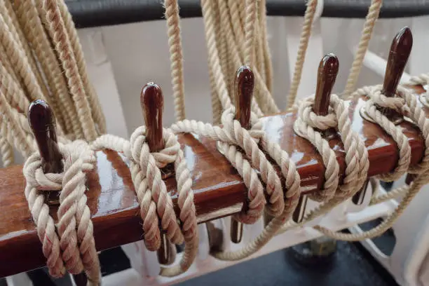 Nautical details on boat deck with rope and marine tool