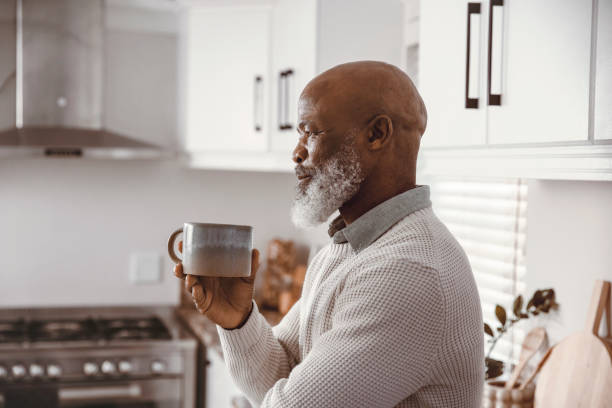 istock Handsome man drinking coffee at home 1500324389