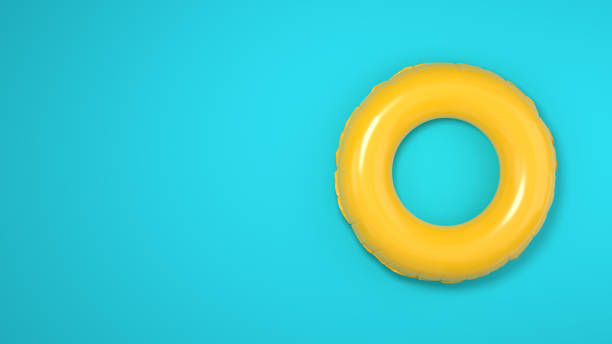 istock Inflatable yellow swimming ring on blue background. 3D rendered image. 1500325460