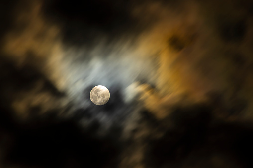 Close up conceptual full moon in blue night sky