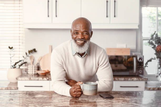 istock Handsome man drinking coffee at home 1500325905