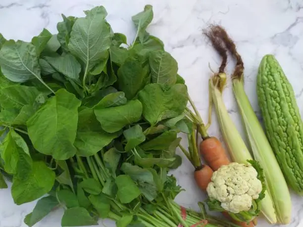 Fresh vegetable, spinach, cauliflower, baby corn, carrot, and bittermelon