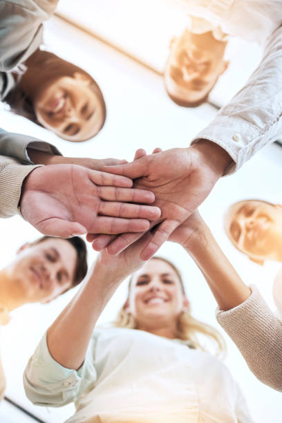 istock Business people, hands stack and circle with smile, team building and support for goals in workplace. Men, women and teamwork with solidarity for happiness, motivation and trust with diversity at job 1500330406