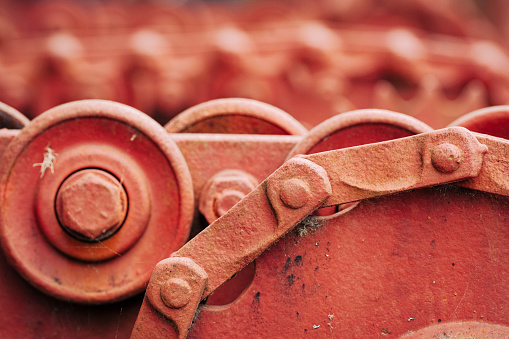 Macro image of painted gears and chains in Ketchican, Alaska