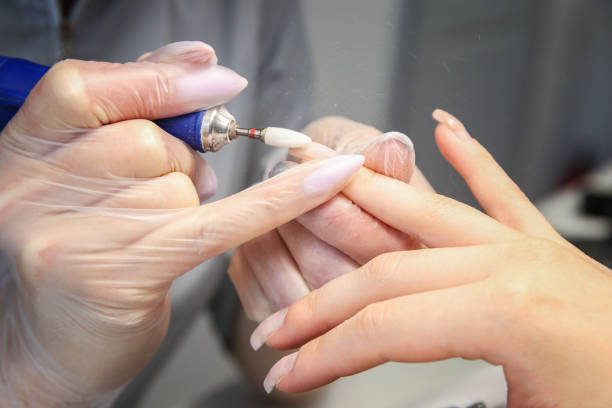 The process of doing manicure in the salon. cutter. Grinding nails, cuticles. Sterilization. Nail service, beauty procedures