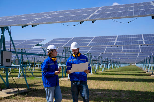 istock Employee is working at solar farm. 1500335342