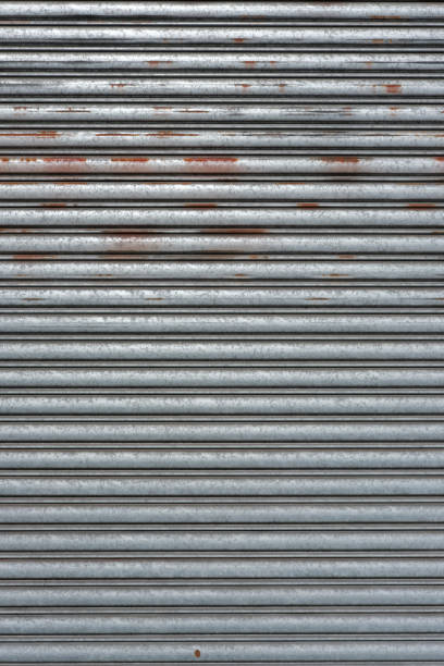An old rusty silver garage door.