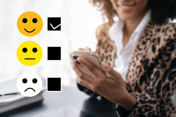 istock User give rating to service experience on online application smartphone. 1500338636