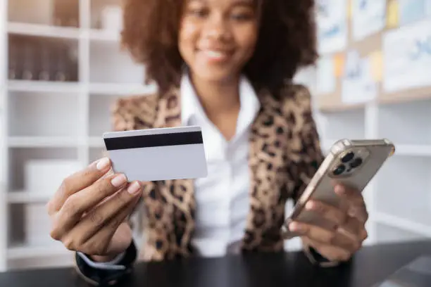 woman hand holding smartphone, tablet and using credit card for online shopping.Online shopping concept.