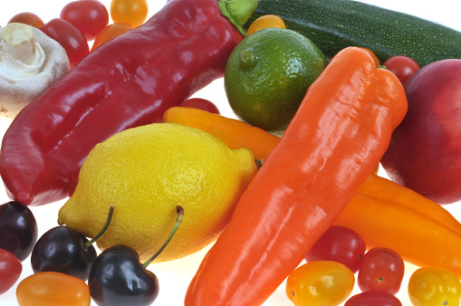 Close shot of red and yellow biquinho peppers.