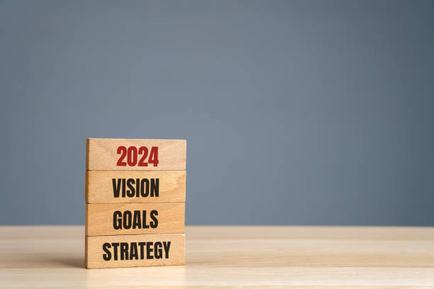 istock Wooden blocks with words 2024 vision, goals, strategy. Setting goal, target for next year. Plans and tasks. Financial management in company. Business and finance concept 1500342755