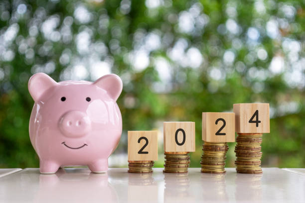 Piggy Bank, Stack of Coins and New Year 2024