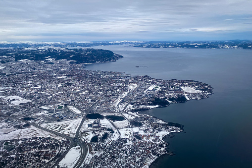 Aerial of snow covered city of Trondheim, Norway in winter