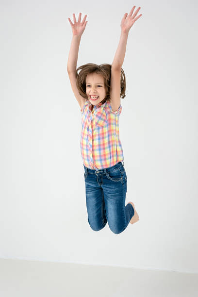 istock Girl jumping against white background 1500349055