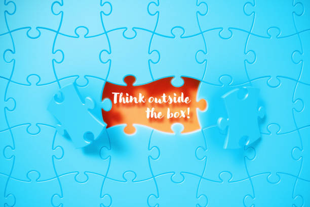 istock Blue Jigsaw Puzzle Pieces Revealing Think Outside The Box Phrase On Orange Background 1500349850
