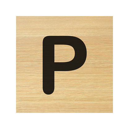 A capital P wood block on white with clipping path