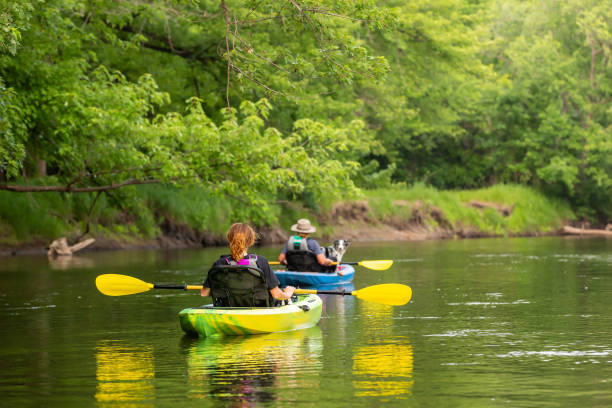 istock Two Girls & Dog Kayaking Down Rum River in Summer 1500350653