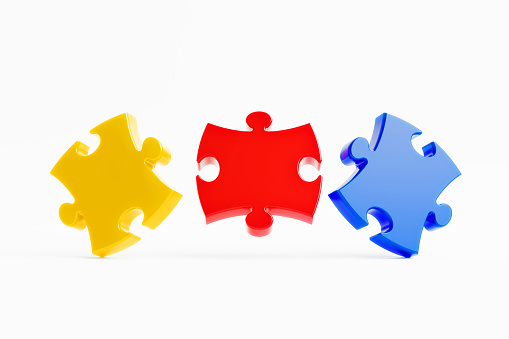 Jigsaw puzzle pieces on white background. Horizontal composition with copy space.