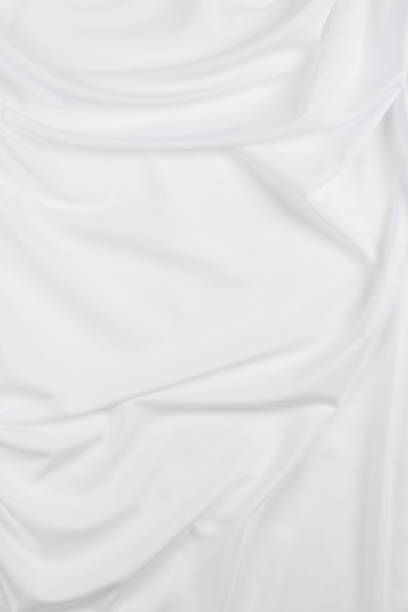 istock white cotton fabric draped, bed linen 1500351255