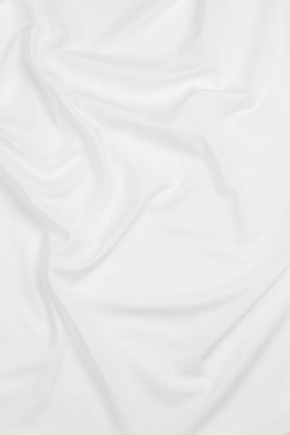 istock white cotton fabric draped, bed linen 1500351335